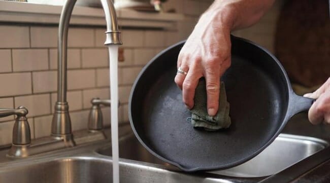 Clean Carbon Steel Pan with sponge